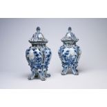A pair of Delft pot-pourri vases and covers with landscapes and romantic scenes, possibly Northern F
