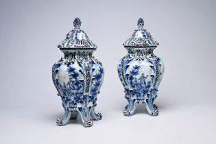 A pair of Delft pot-pourri vases and covers with landscapes and romantic scenes, possibly Northern F