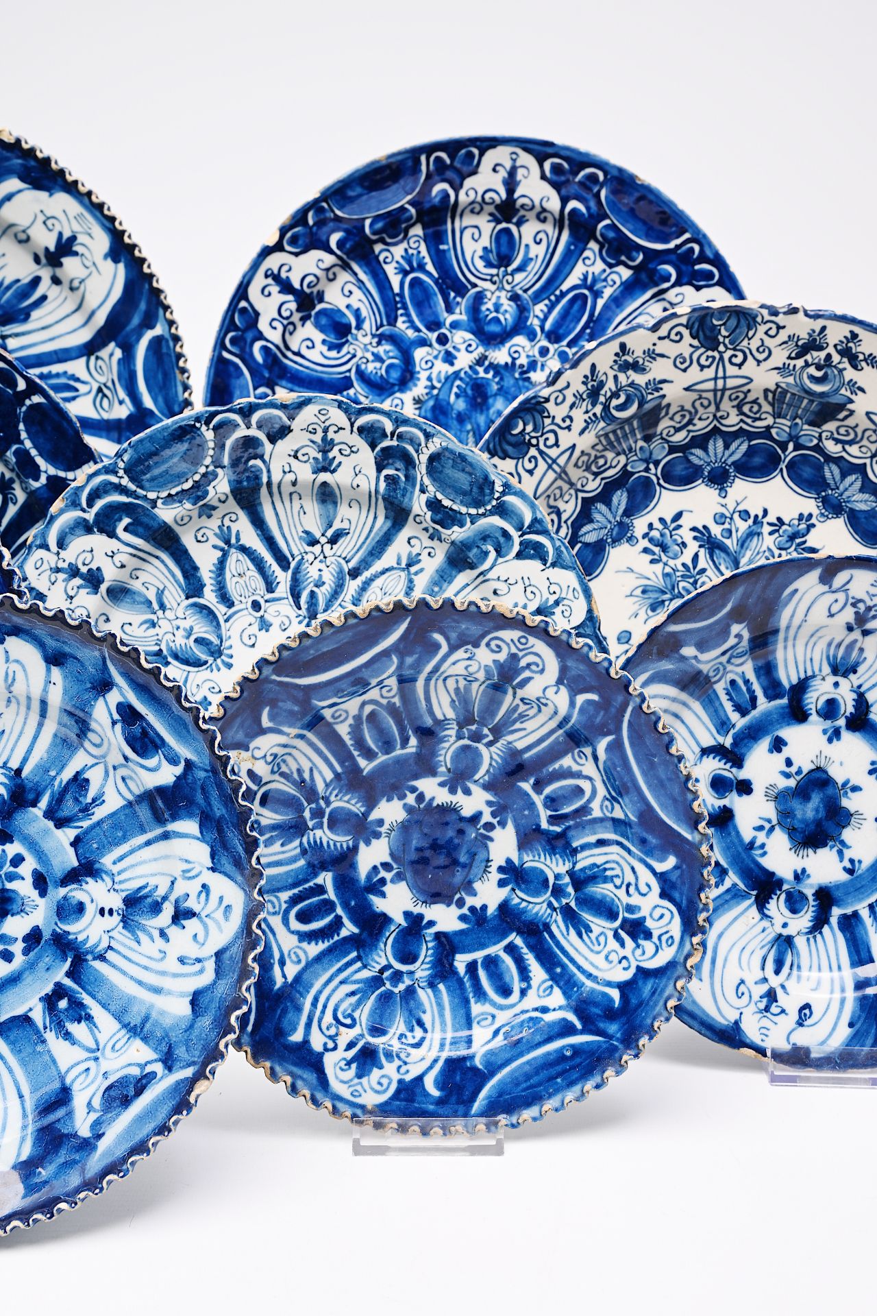 A varied collection of Dutch Delft blue and white plates and dishes with floral design, 18th C. - Image 3 of 8
