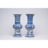A pair of Chinese blue and white 'gu' vases with dragons and floral design, Qianlong mark, Republic,