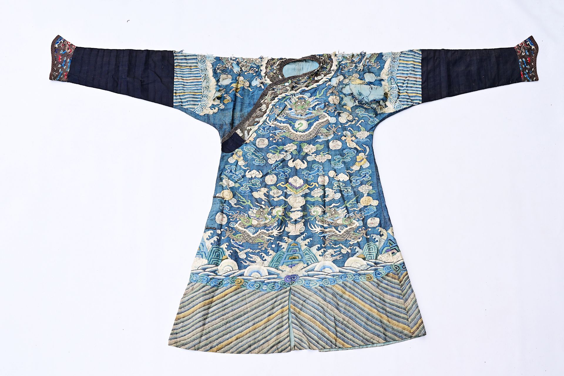 A Chinese embroidered silk 'dragons chasing the pearl' robe, 19th C.