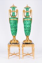 A pair of large gilt bronze mounted faux-malachite vases on matching gilt wood bases with marble top