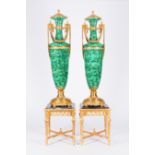A pair of large gilt bronze mounted faux-malachite vases on matching gilt wood bases with marble top