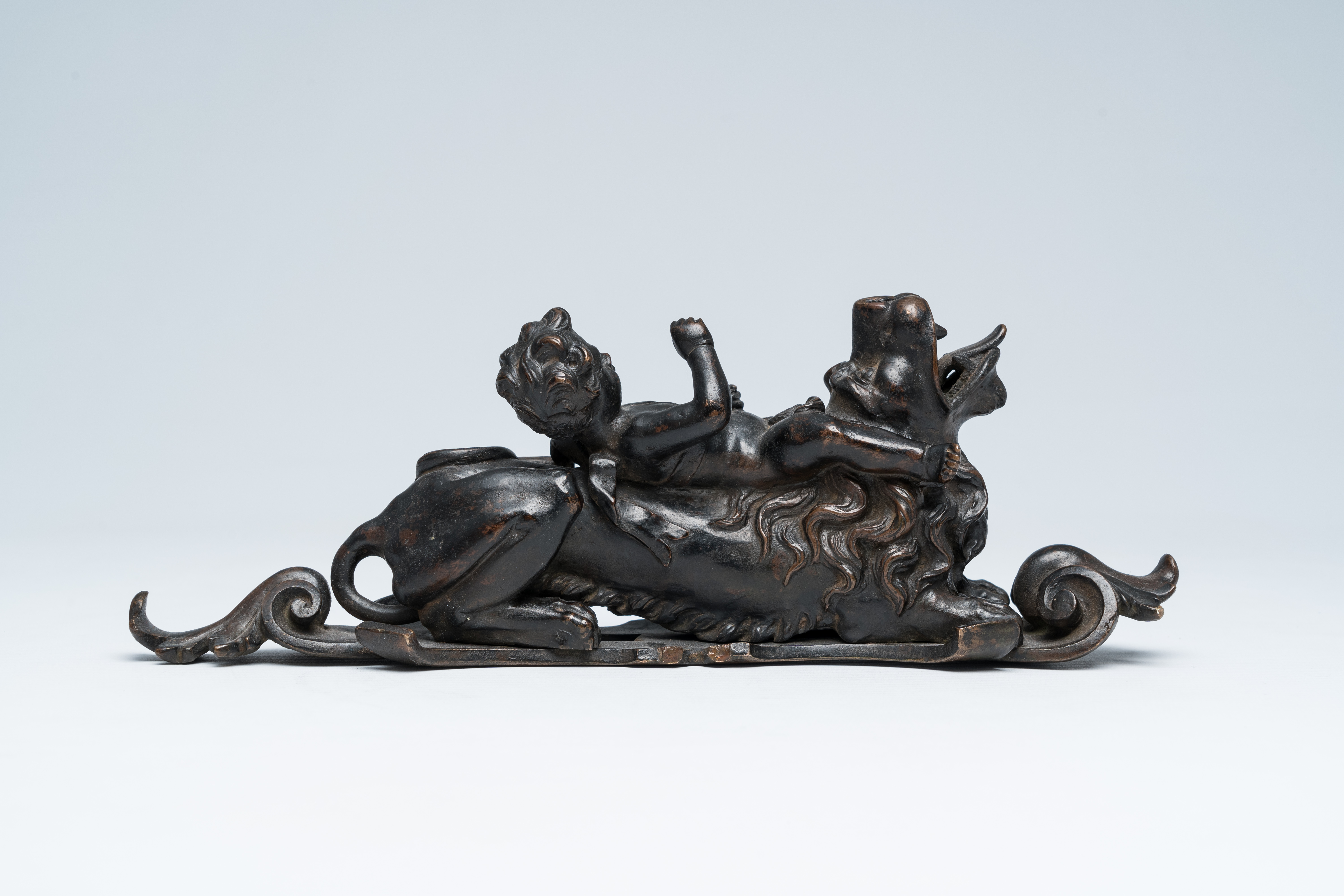 A Flemish patinated bronze door knocker with a jolly putto on a lion, presumably Antwerp, early 18th - Image 4 of 8