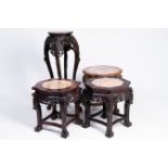 Four Chinese reticulated hardwood stands with marble tops, 20th C.
