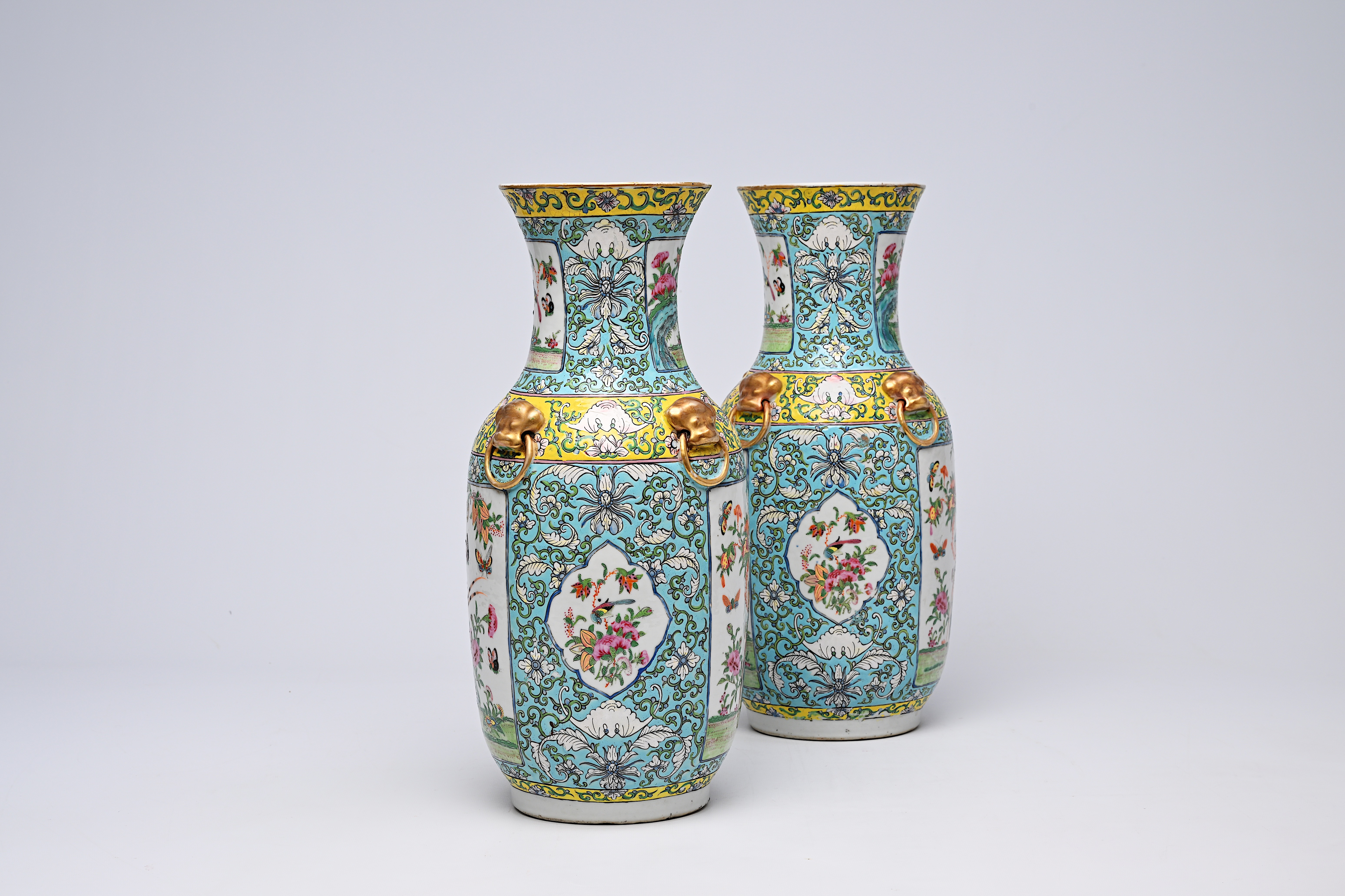 A pair of Chinese Canton famille rose turquoise ground vases with birds and butterflies among blosso - Image 8 of 13
