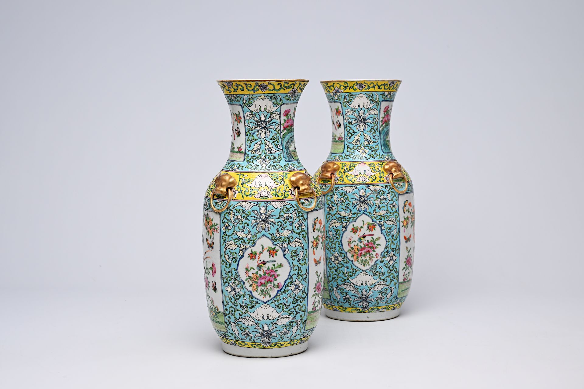 A pair of Chinese Canton famille rose turquoise ground vases with birds and butterflies among blosso - Bild 8 aus 13