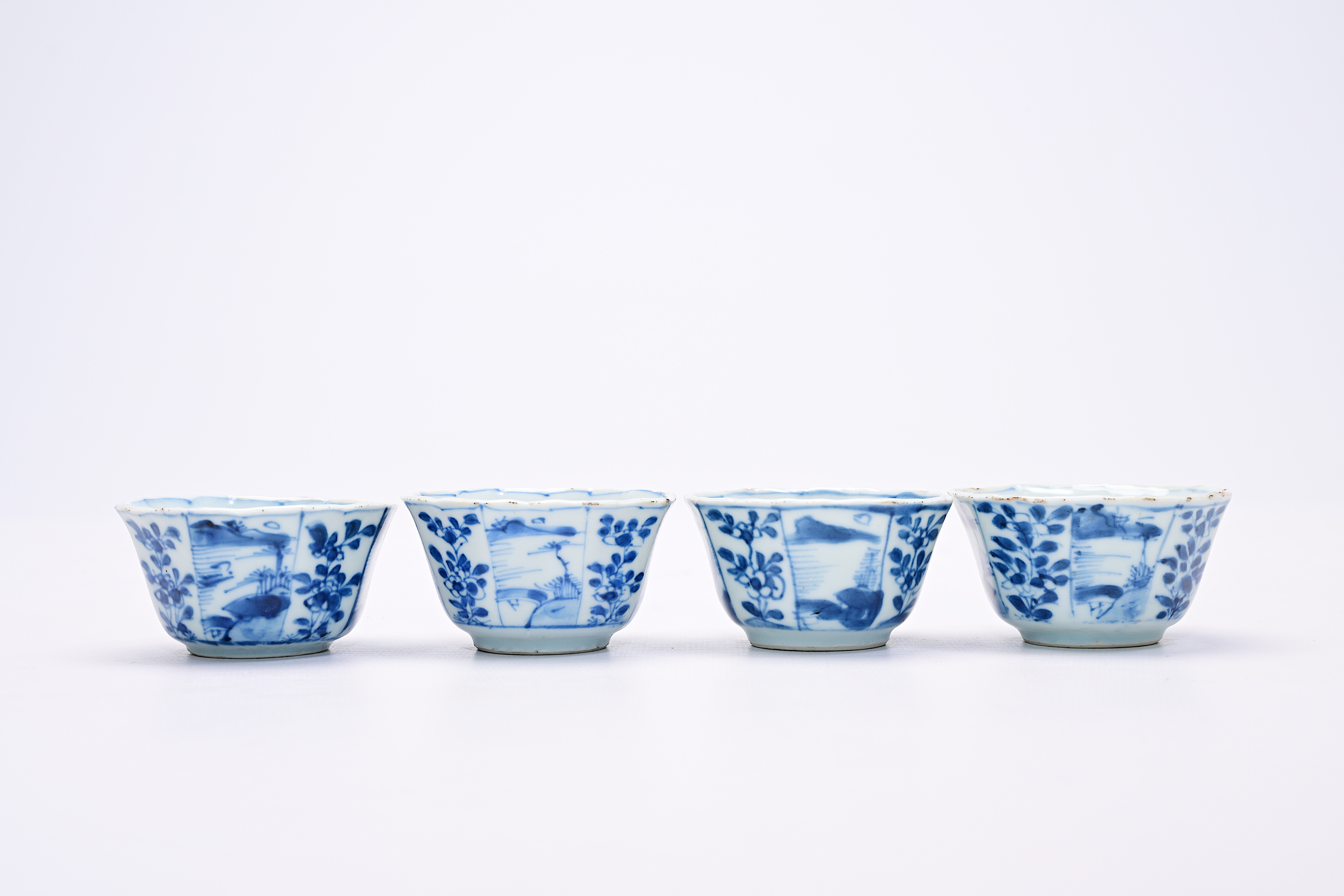 Four Chinese blue and white cups and saucers with floral design and landscapes, Kangxi - Image 3 of 12