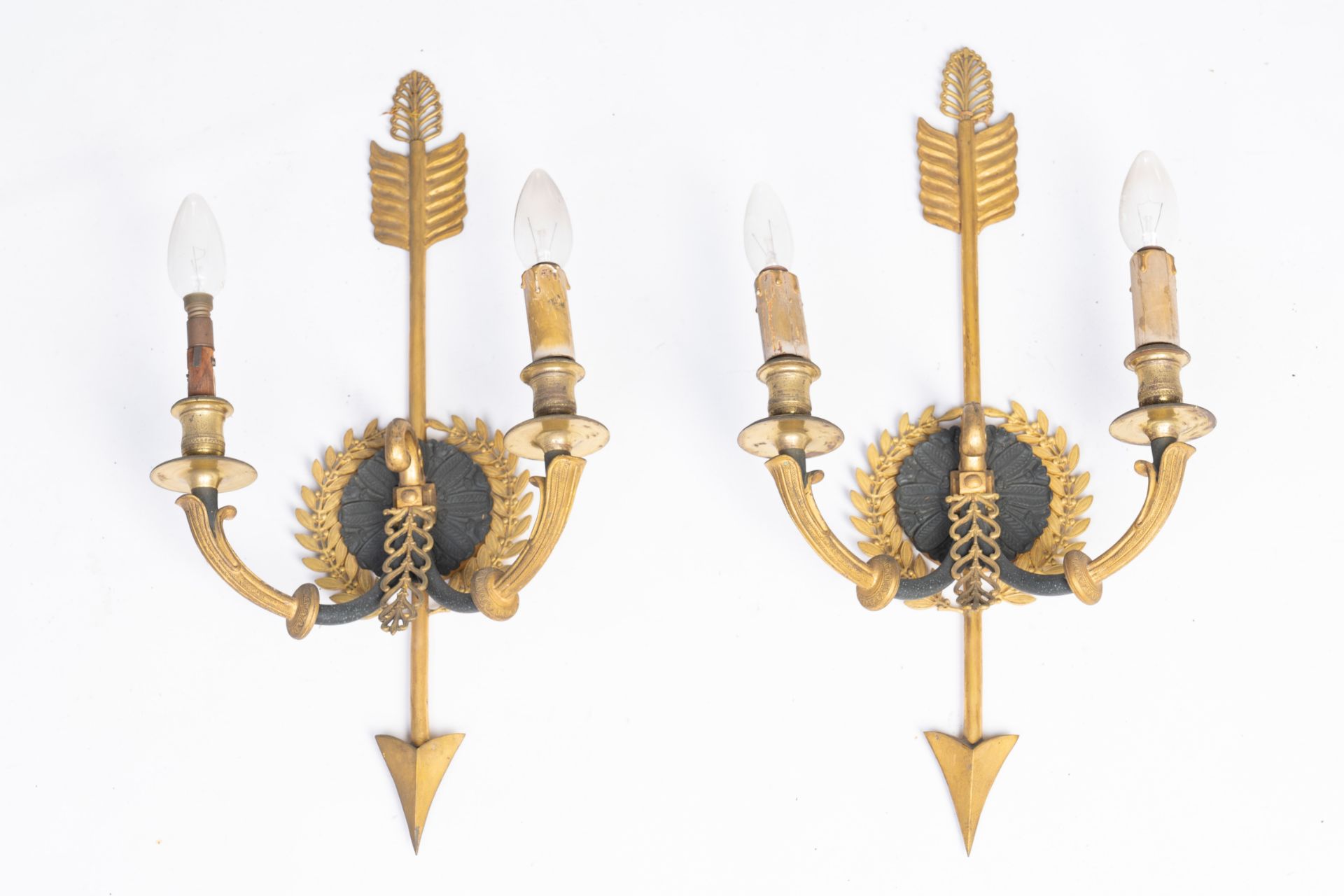 A pair of French Empire-style gilt and patinated bronze two-armed wall lighting appliques, 19th/20th