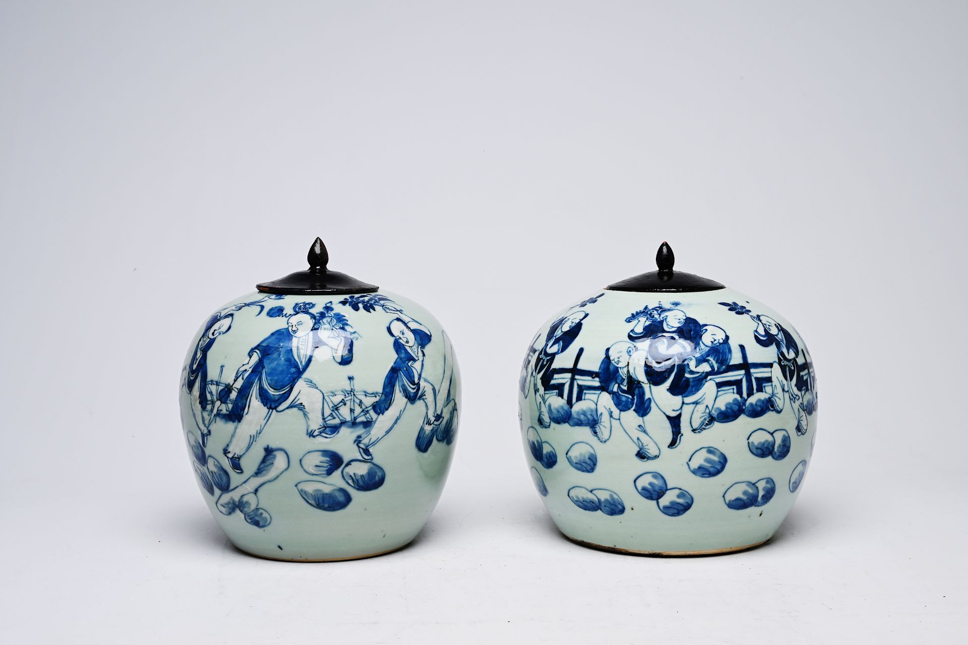 Two Chinese blue and white celadon ground jars and covers with playing children on a terrace, 19th/2 - Image 2 of 5