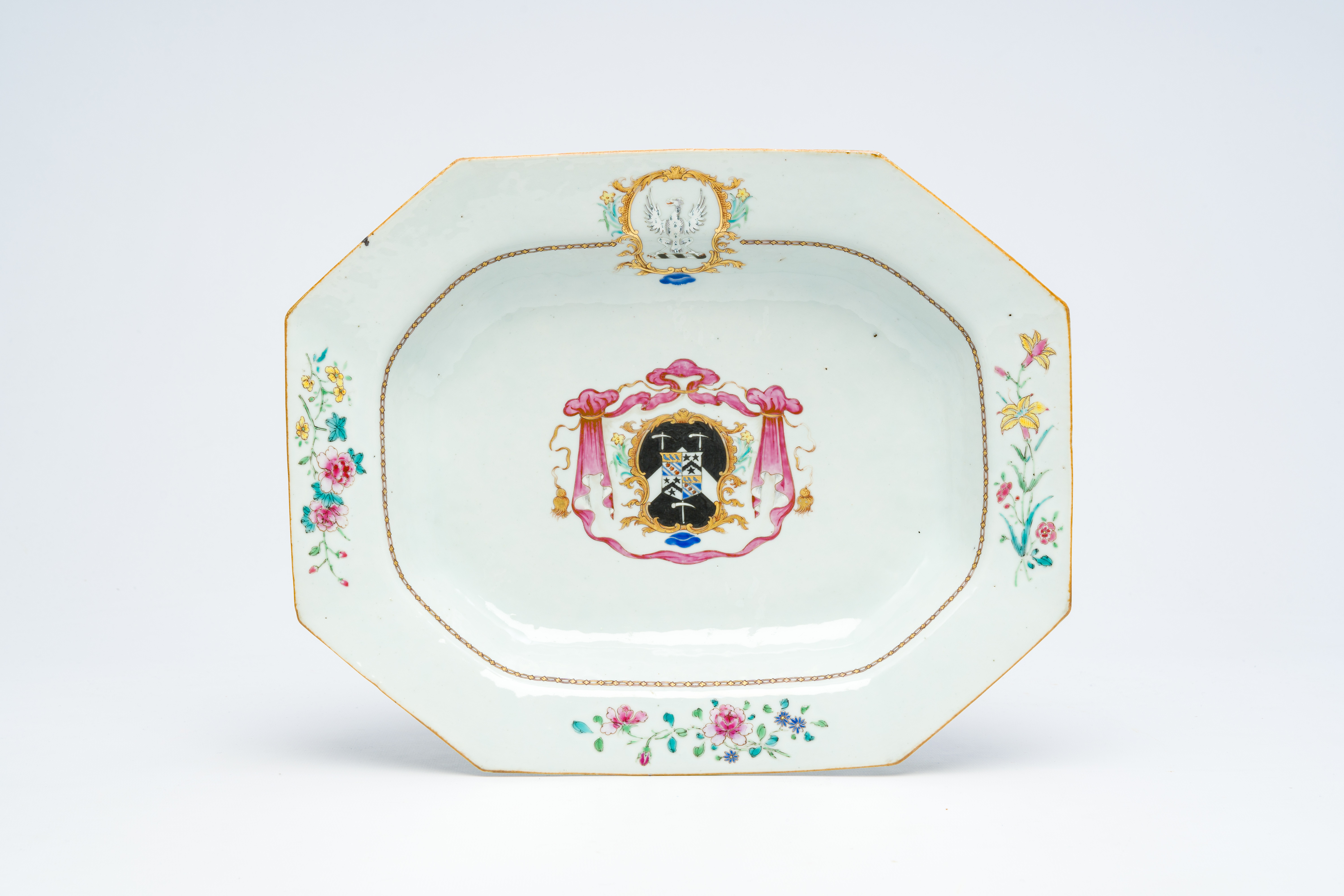 A Chinese famille rose English market octagonal armorial dish with the arms of 'Mosley impaling Pull
