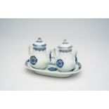 A Chinese blue, white and gilt cruet set with floral design, Qianlong