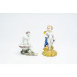 A polychrome 'putto and bird' faience sculpture and a 'lady with a shell' salt cellar, Delft or Brus
