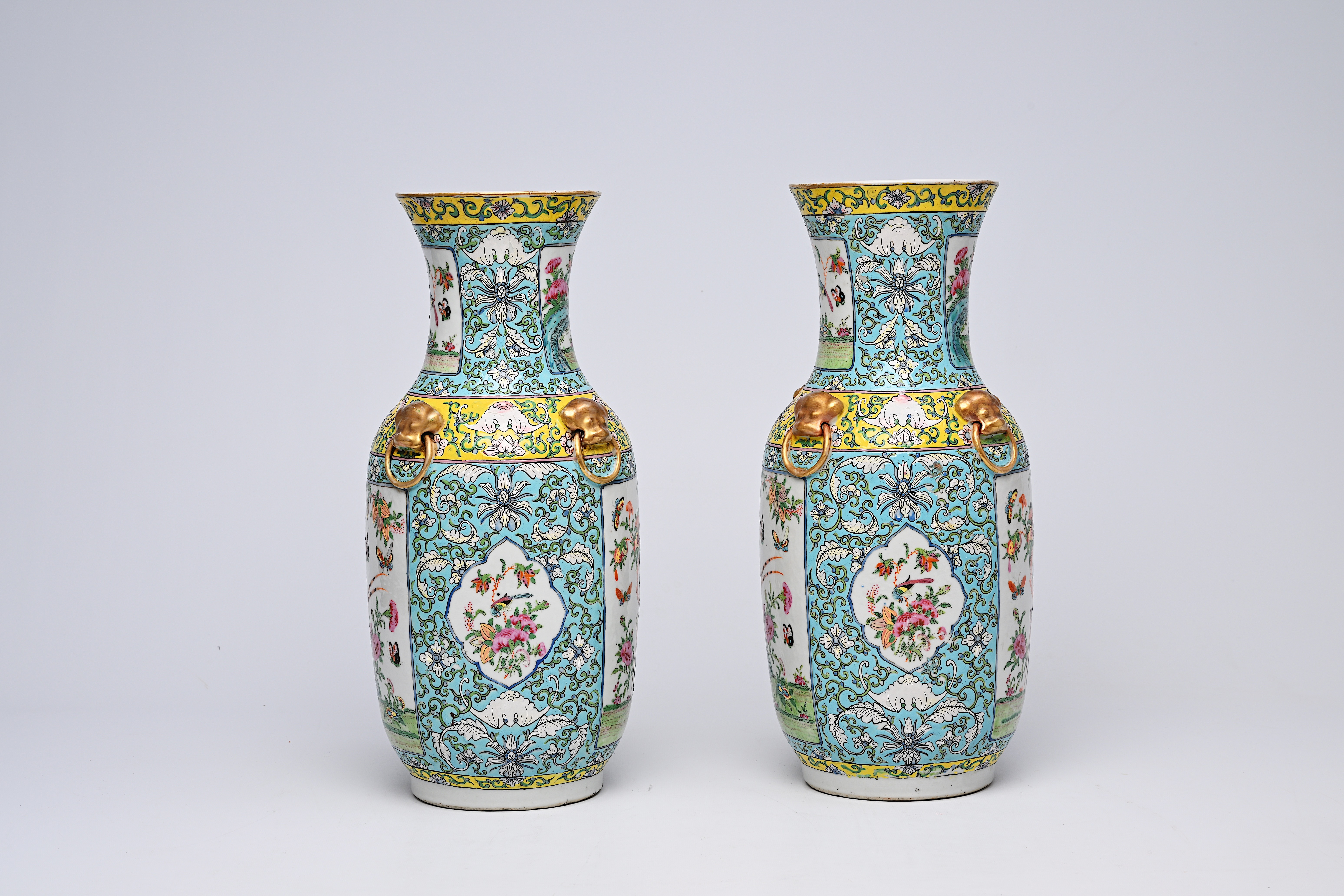 A pair of Chinese Canton famille rose turquoise ground vases with birds and butterflies among blosso - Image 2 of 13