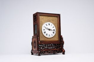 A Chinese reticulated wood fusee clock with brass plaque, 19th C.