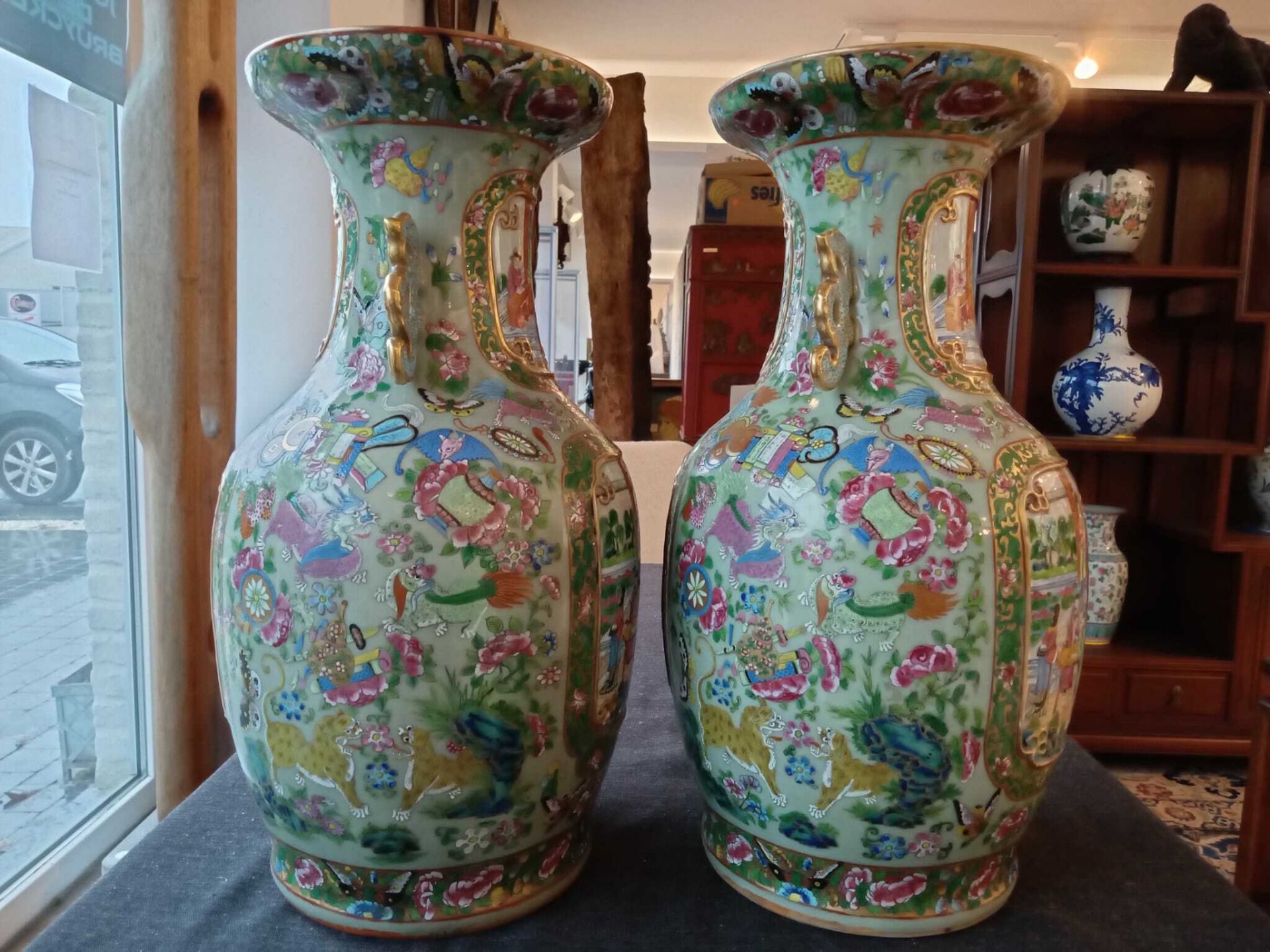 A pair of Chinese Canton famille rose celadon ground vases with palace scenes, animals and antiquiti - Image 20 of 64