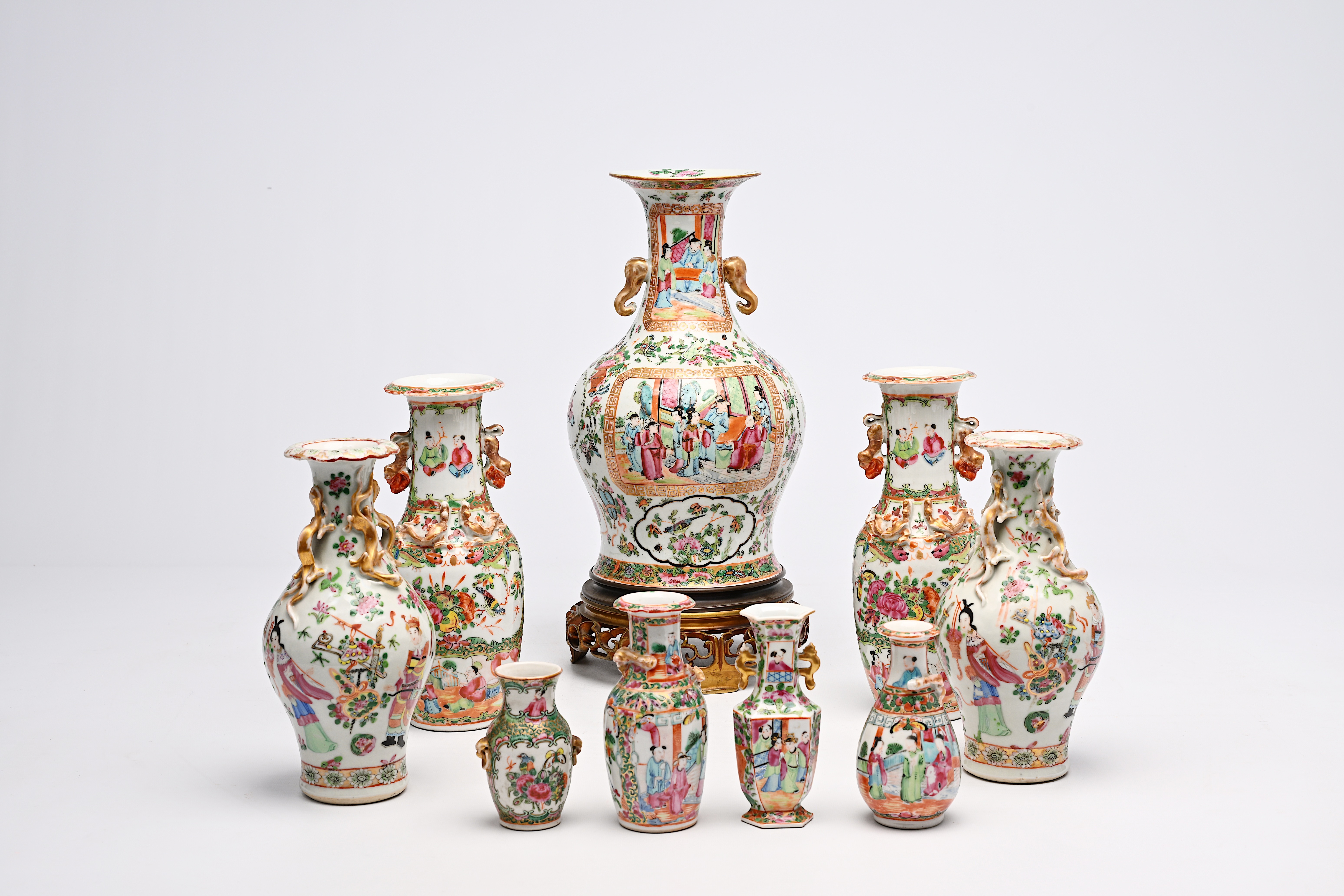 A varied collection of nine Chinese Canton famille rose vases, including two pairs, 19th C. - Image 2 of 8