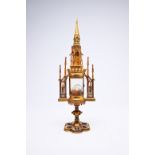 A French Gothic revival brass cathedral-shaped monstrance with enamel plaques, 19th C.
