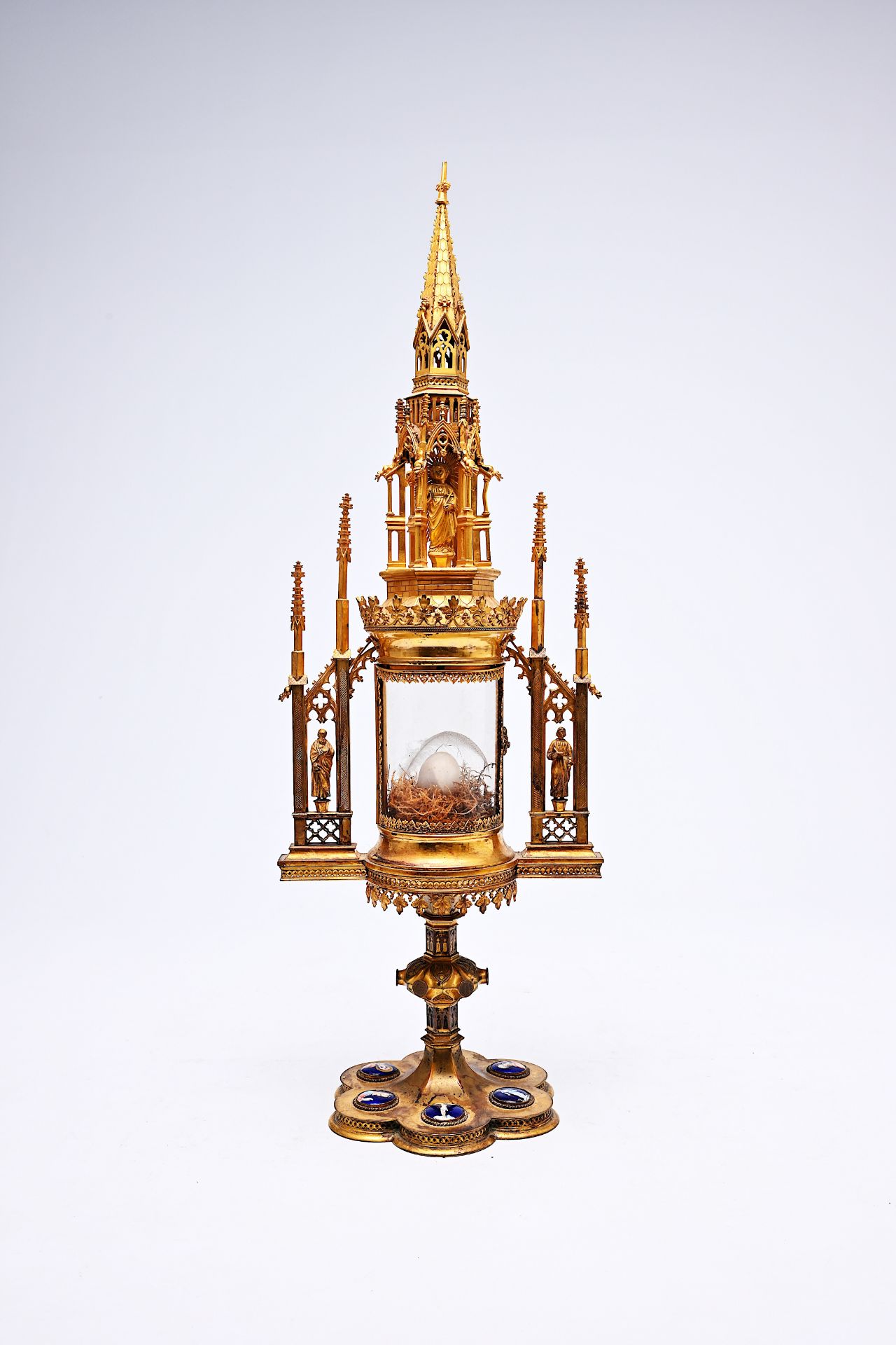 A French Gothic revival brass cathedral-shaped monstrance with enamel plaques, 19th C.