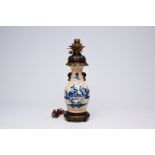 A Chinese blue and white Nanking crackle glazed vase with an immortal and his servant mounted as a l
