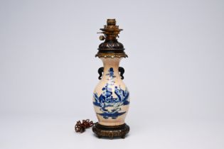 A Chinese blue and white Nanking crackle glazed vase with an immortal and his servant mounted as a l