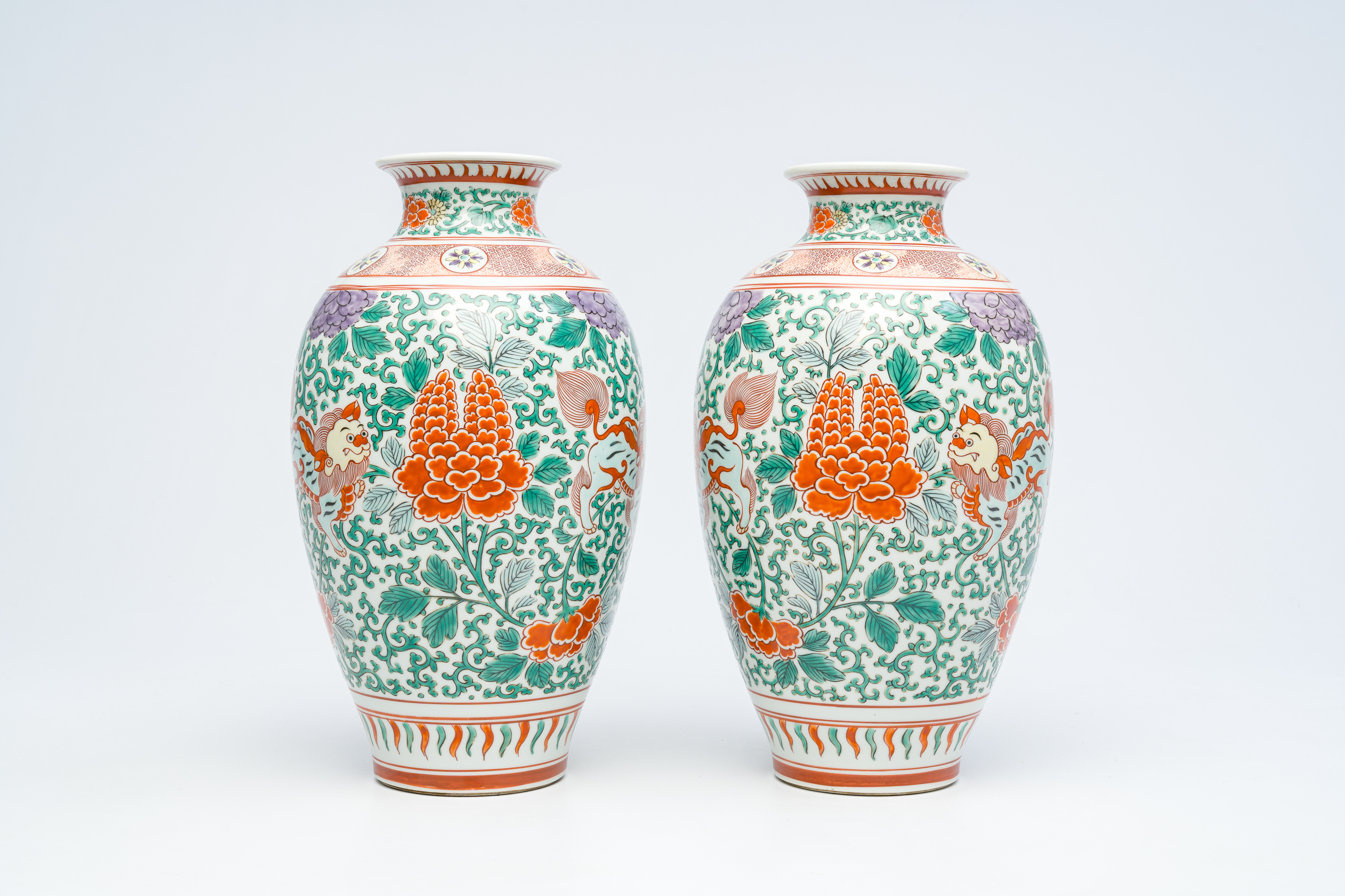 A pair of Japanese wucai style 'peony and Buddhist lions' vases, Meiji, ca. 1900 - Image 2 of 6