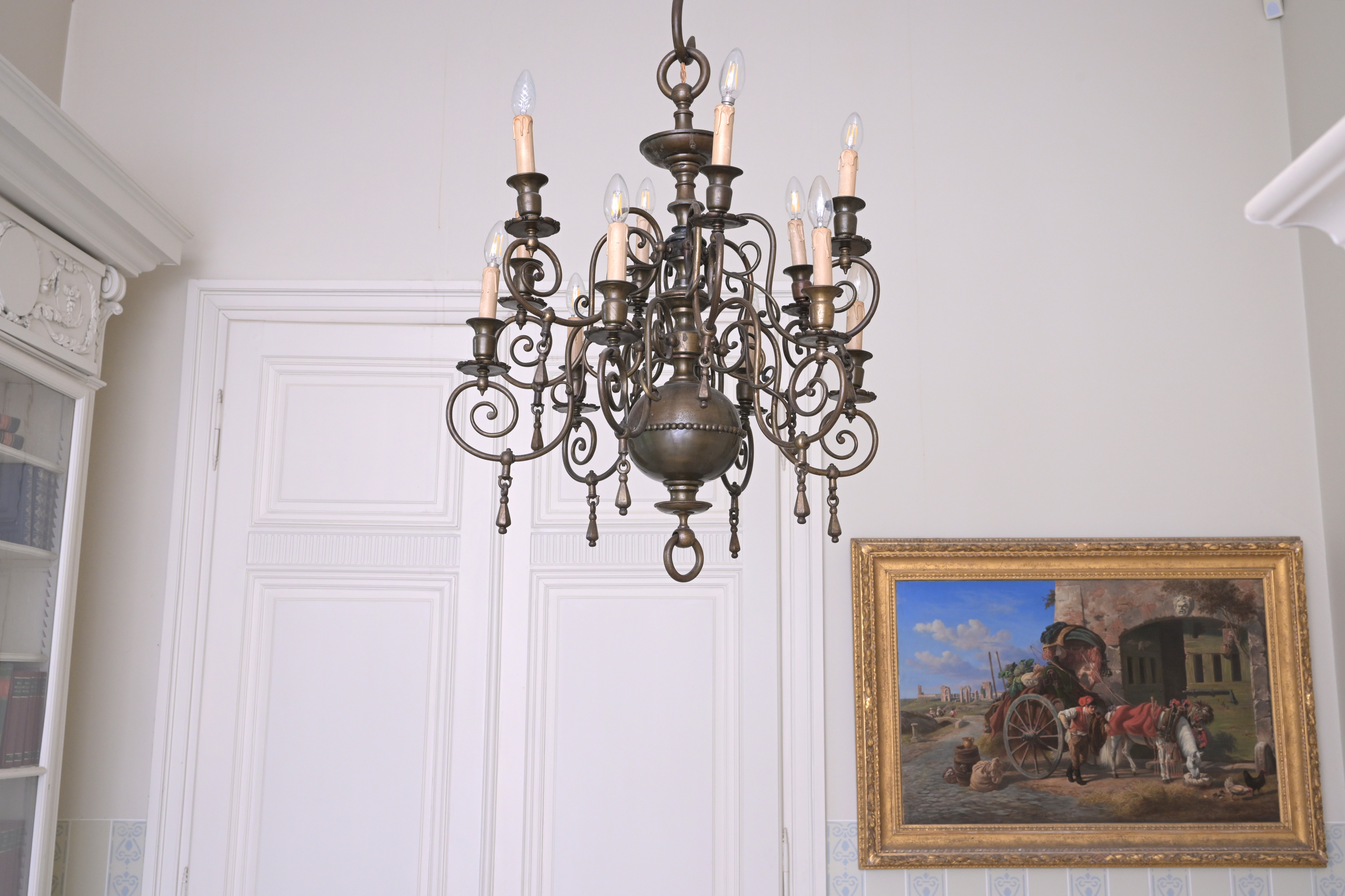 A Renaissance style bronze twelve-light 'ball' chandelier, 19th/20th C.