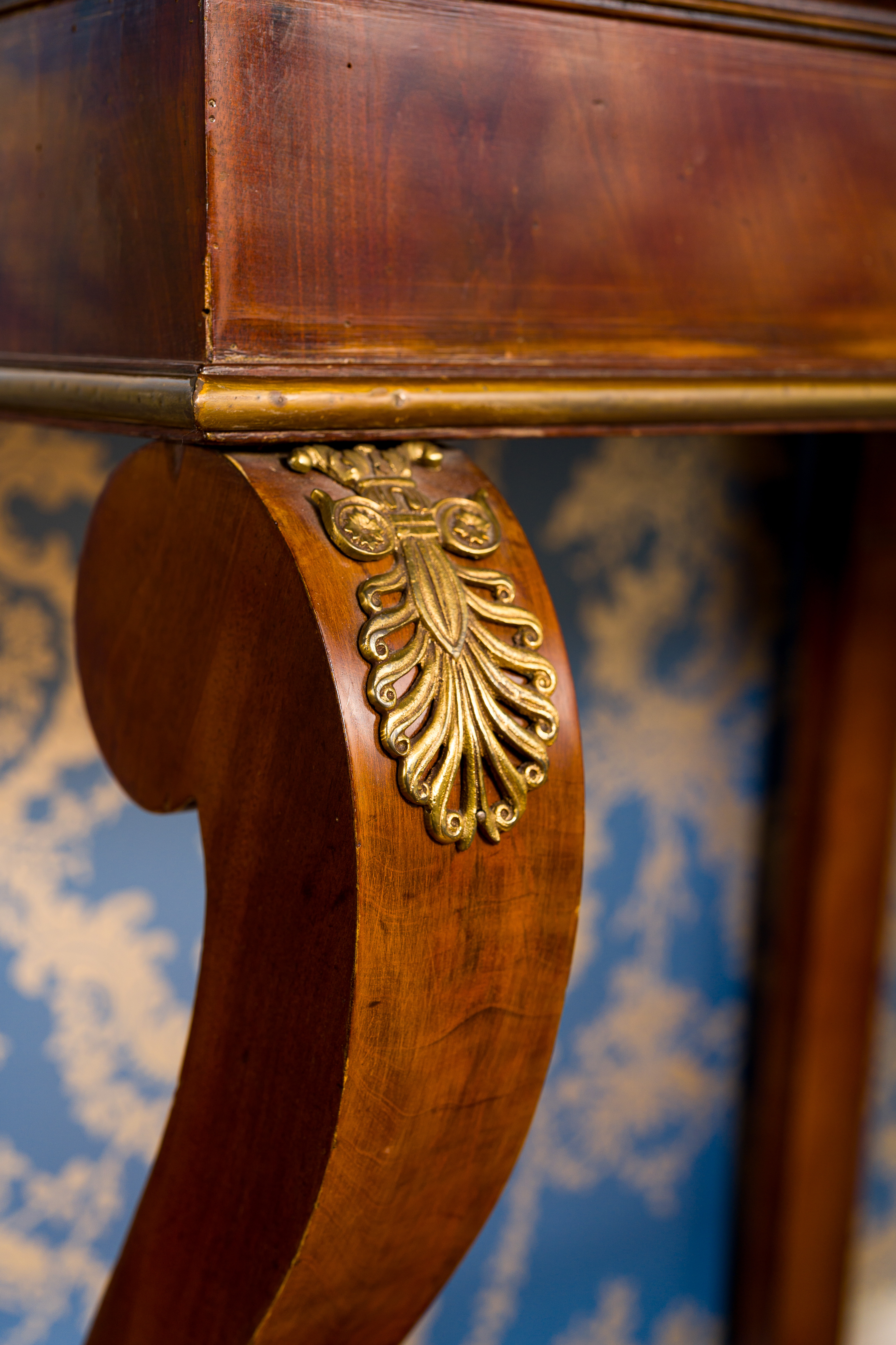 A French gilt bronze mounted mahogany veneered console with marble top, 19th C. - Image 4 of 7