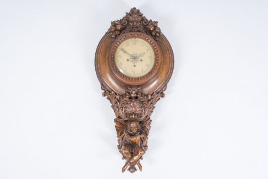 An imposing large wooden wall clock crowned with a satyr head and supported by a musician, 19th C. - Image 1 of 8