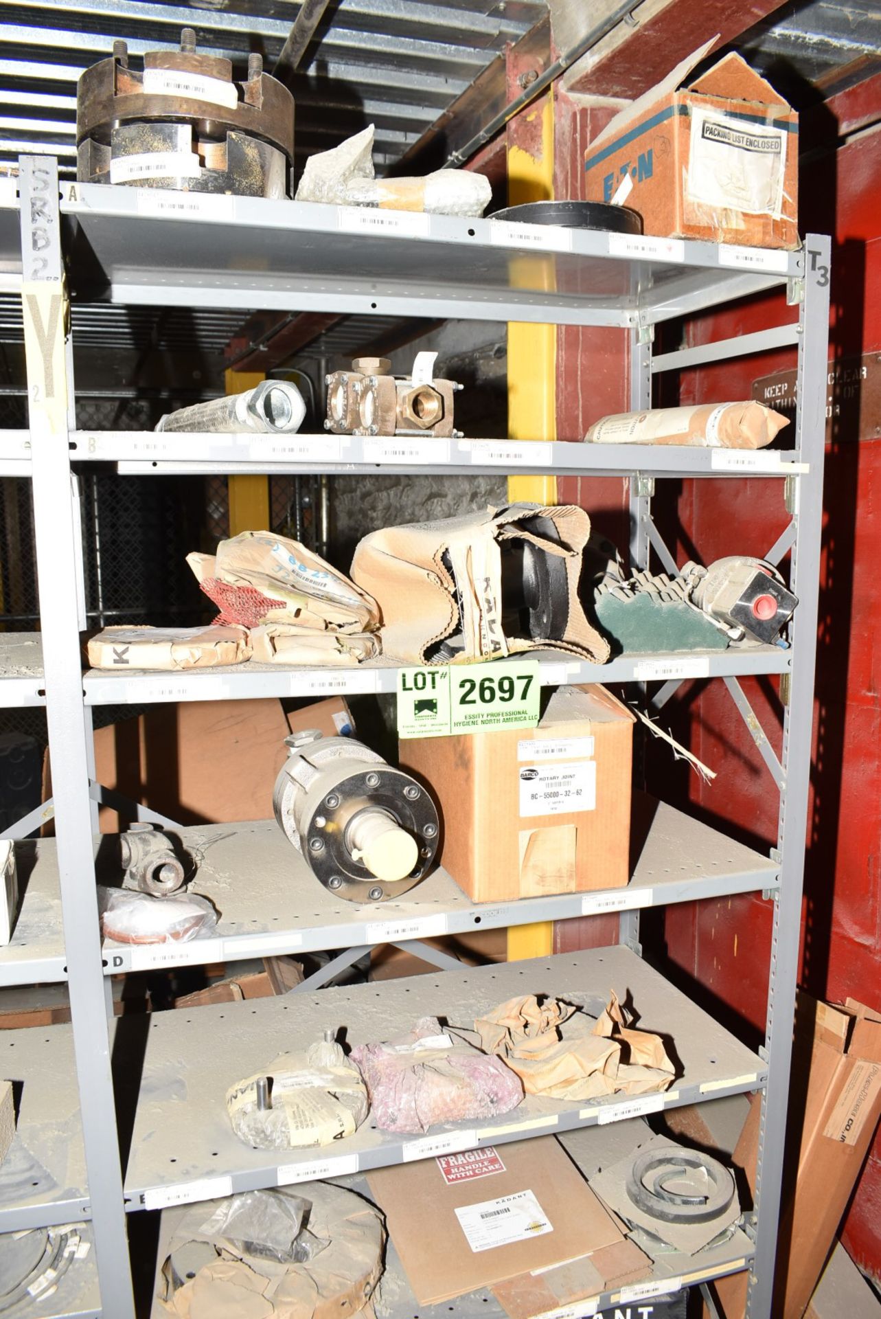 LOT/ CONTENTS OF SHELF - INCLUDING FLEX COUPLINGS, SLITTER BLADES, SPARE PARTS [RIGGING FEES FOR LOT