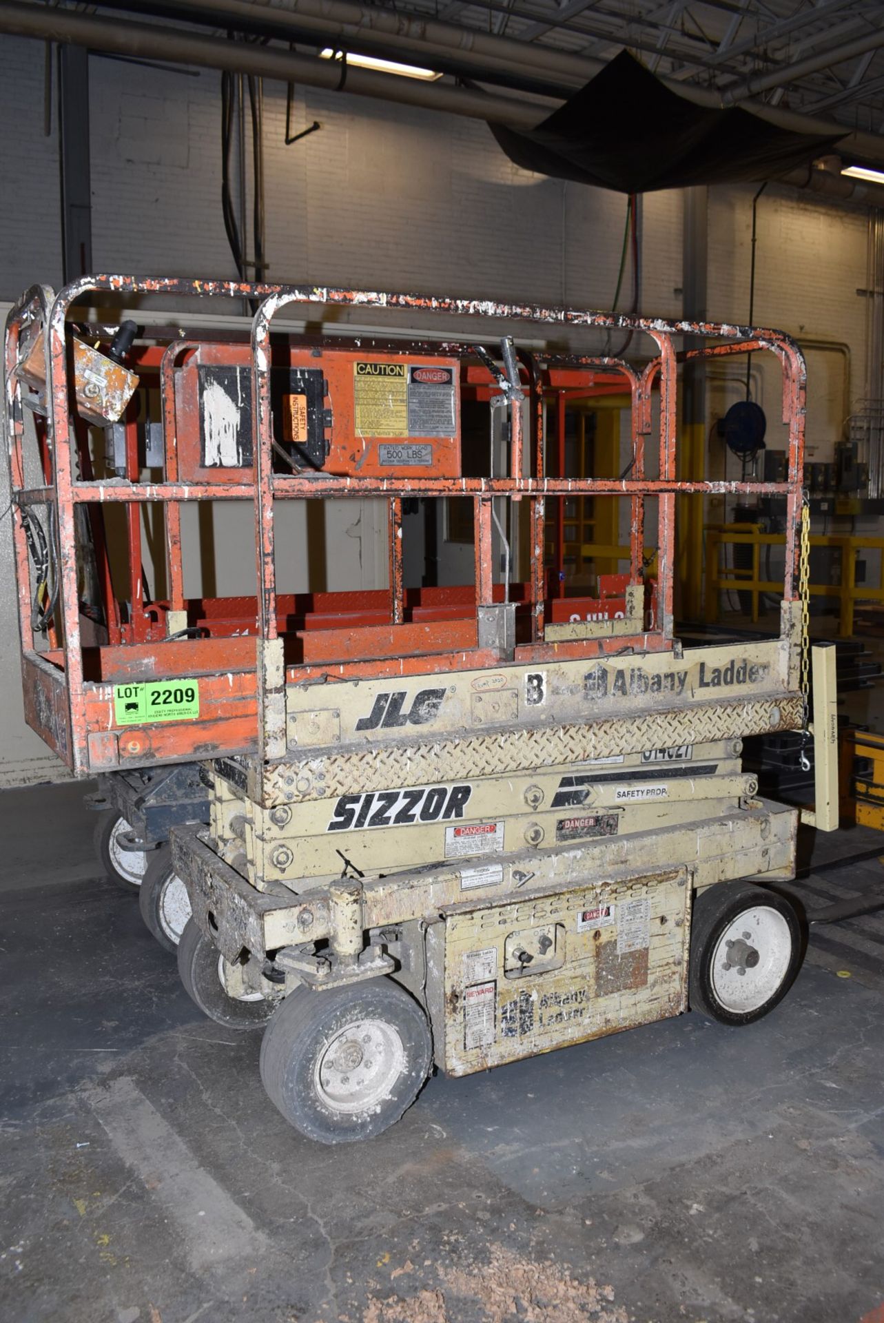 JLG CM-1432 ELECTRIC SCISSOR LIFT WITH 14' MAX VERTICAL REACH, 500 LBS. CAPACITY, 24 VOLT BATTERY