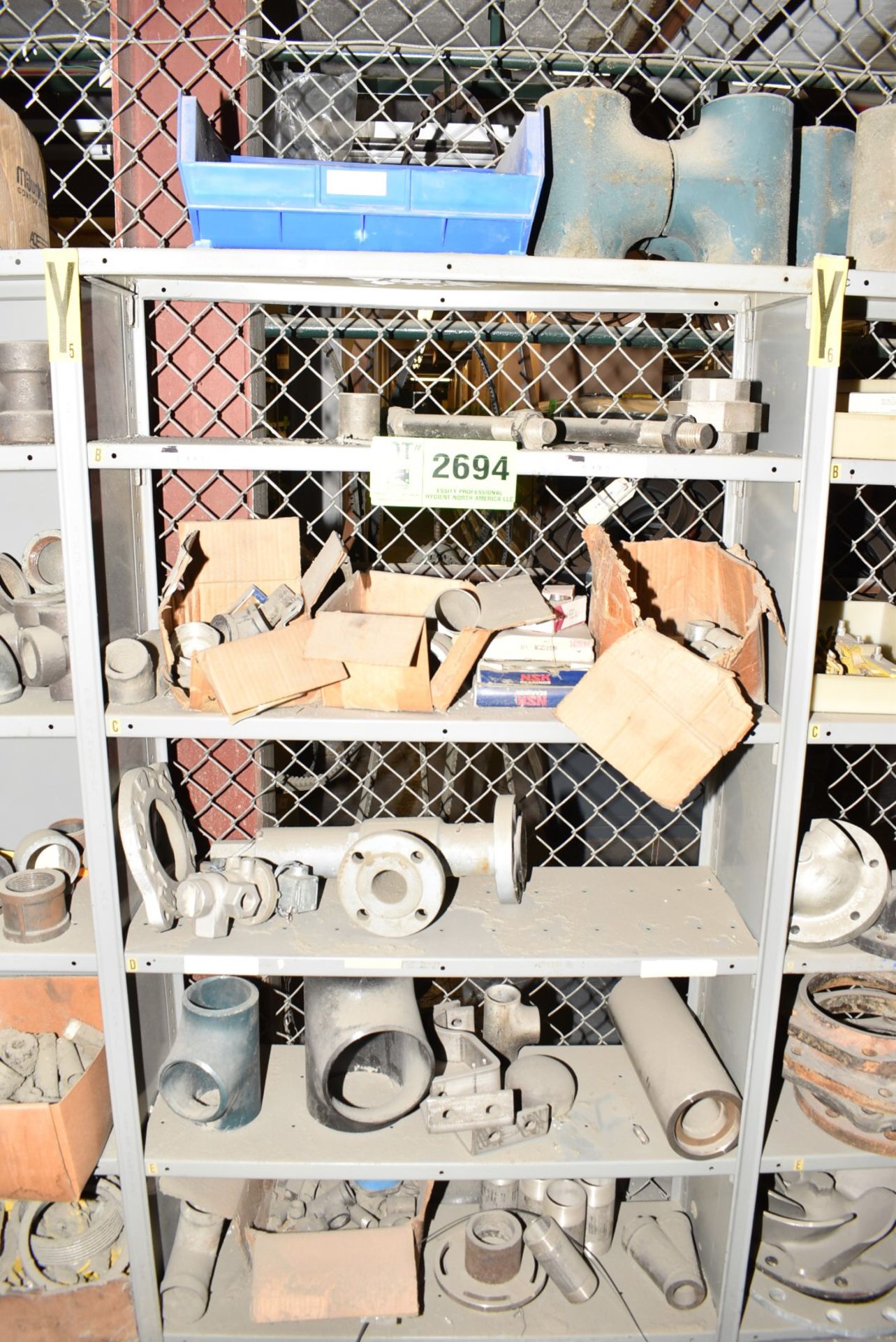 LOT/ CONTENTS OF SHELF - INCLUDING COUPLINGS, FLANGES, SPARE PARTS [RIGGING FEES FOR LOT #2694 - $