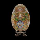 Russian gilded and enamel Easter egg on a silver stand, Russian, 20th century.
