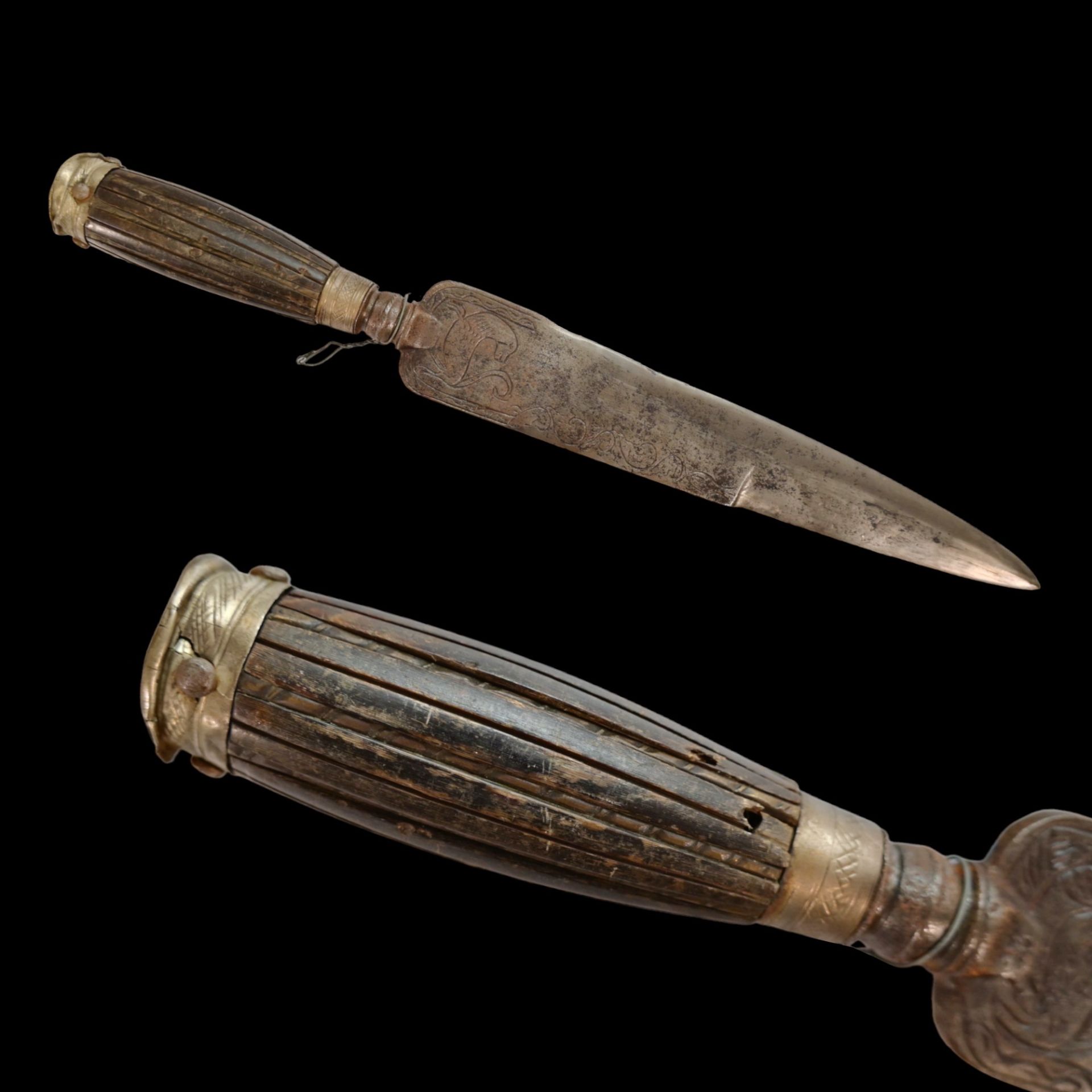 A Italian hunting knife, late 18th C., with engraving on the blade, horn handle in a silver mounting