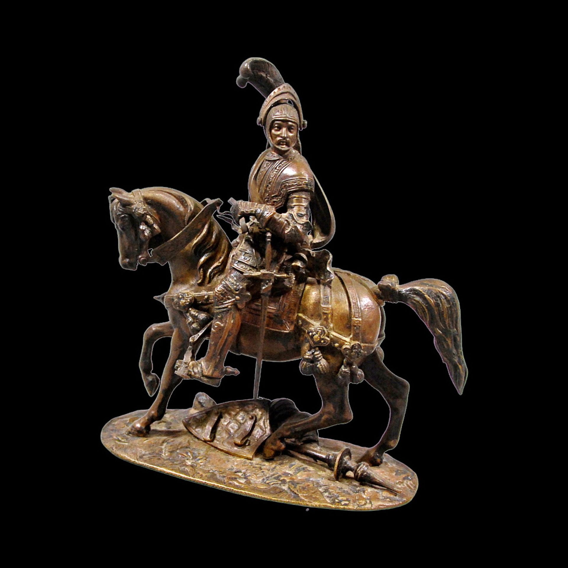 A bronze composition depicting an equestrian knight of the medieval period at a tournament.