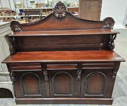 Reproduction Victorian-style mahogany sideboard having single shelf to the top with carved