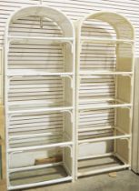 White painted bamboo and cane effect shelving unit having five glazed shelves and another similar