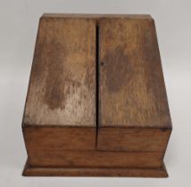 Victorian oak stationery box of canted hinged form enclosing a series of tiered racks and a pen