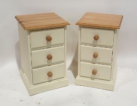 Pair of modern cream painted pine bedside cabinets, each comprising three drawers, with turned