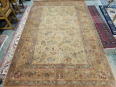 Modern cream ground Royal Keshan wool pile carpet with central floral pattern, multiple floral and