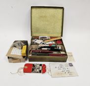 Stationery box enclosing a collection of vintage ballpoint and fountain pens and a collection of