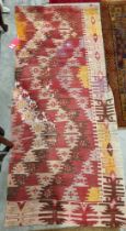 Early 20th century Persian or Turkish kilim, woven with geometric zig-zag shaped bands in red, brown