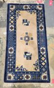 Small Chinese wool pile rug, the peach field with flowerhead and precious object decoration,