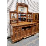 Large 19th century figured oak sideboard with unusually large mirrored top section, raised over
