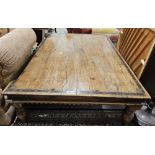 Large iron-bound hardwood coffee table, probably Asian, 20th century, the plank top riveted with