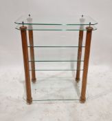 A contemporary glass storage/TV stand with various shelves and wooden support, measuring approx 89