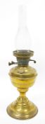 Victorian brass-mounted oil lamp, with pierced burner, marked 'British Made' above clear chimney