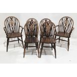 Set of six oak Windsor wheelback dining chairs including two carvers, one with label to underside
