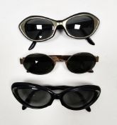 Three pairs of lady's sunglasses comprising a gilt metal pair by Giorgio Armani, a blue and silvered