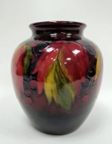 Moorcroft 'Leaf and Berry' pattern oviform vase, 20th century, painted and impressed marks, tube